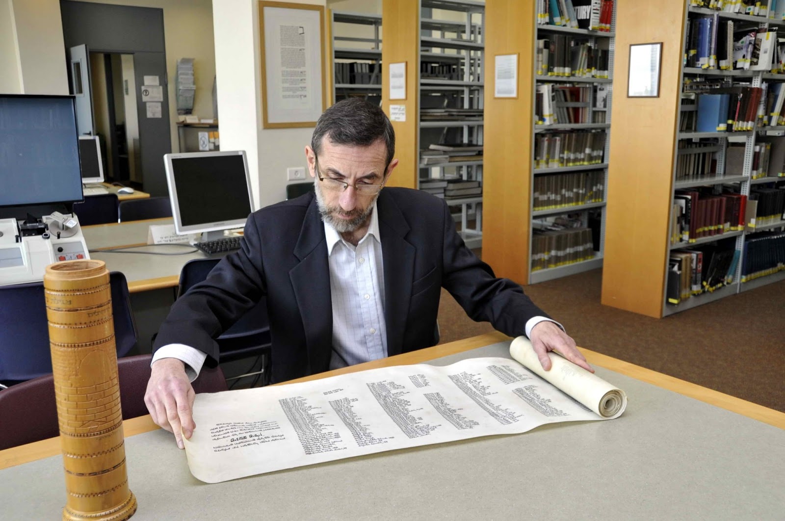 Alexander Avram examines the scroll of names